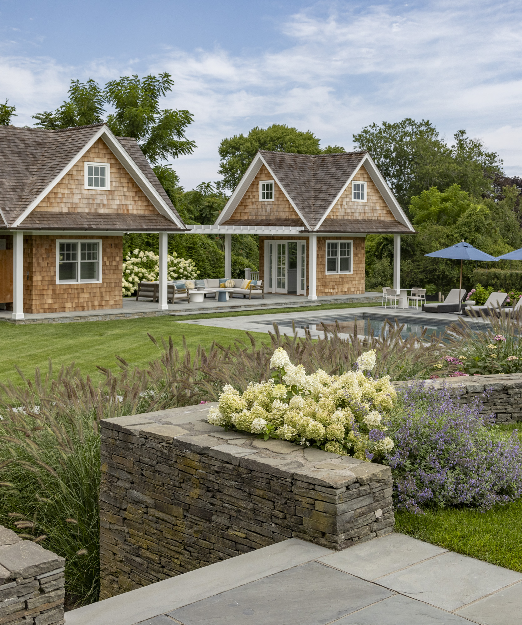 landscape design with lawn trees and shrubs